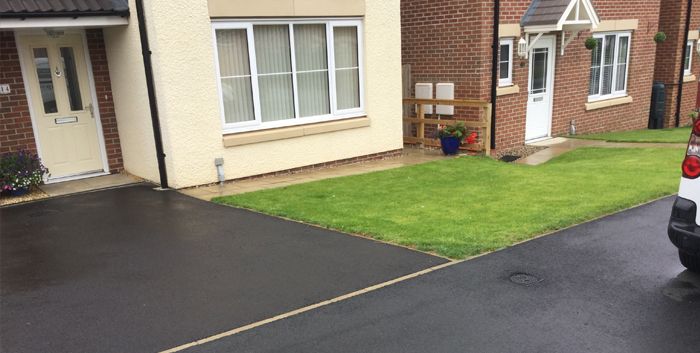 Before image of a tarmac driveway in Wakefield